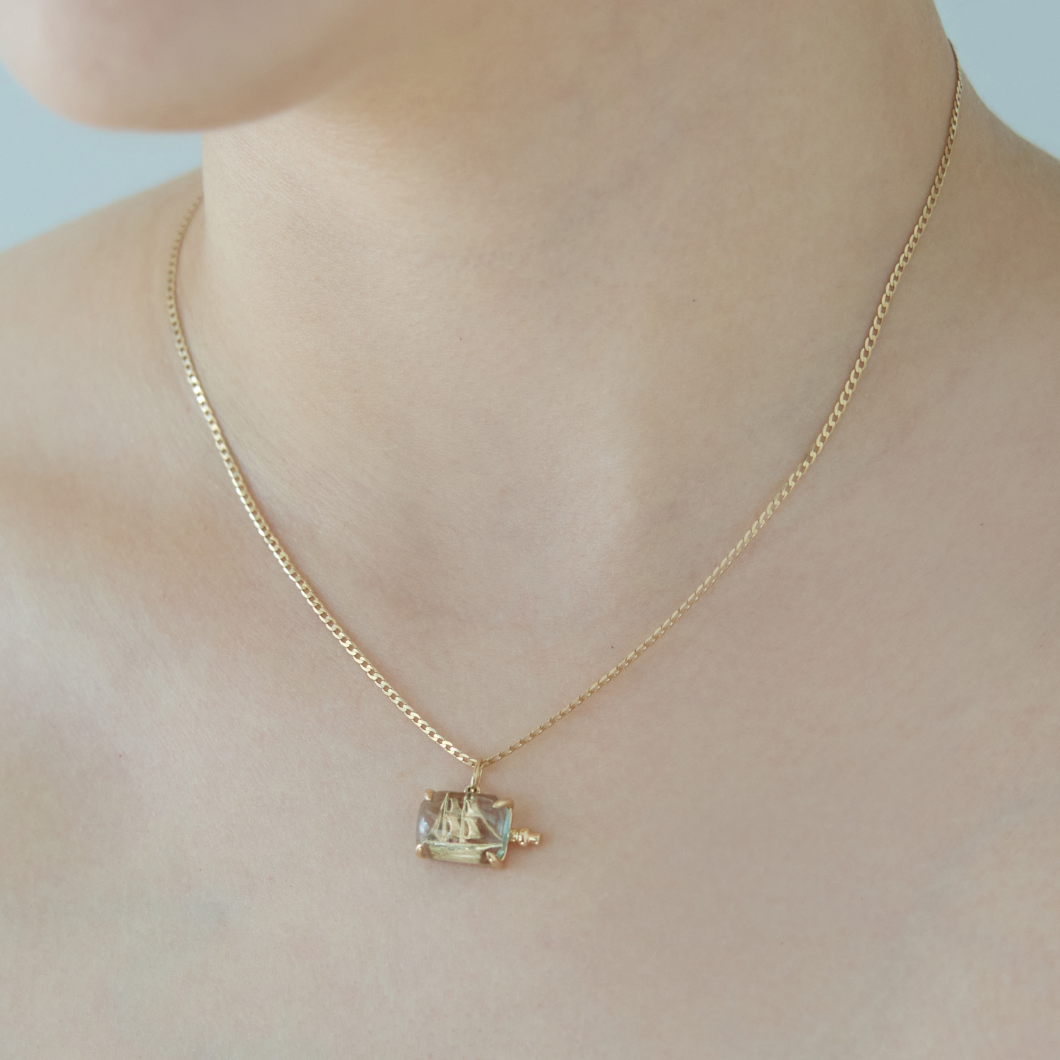 Alternative view of Nomad Gold Charm
