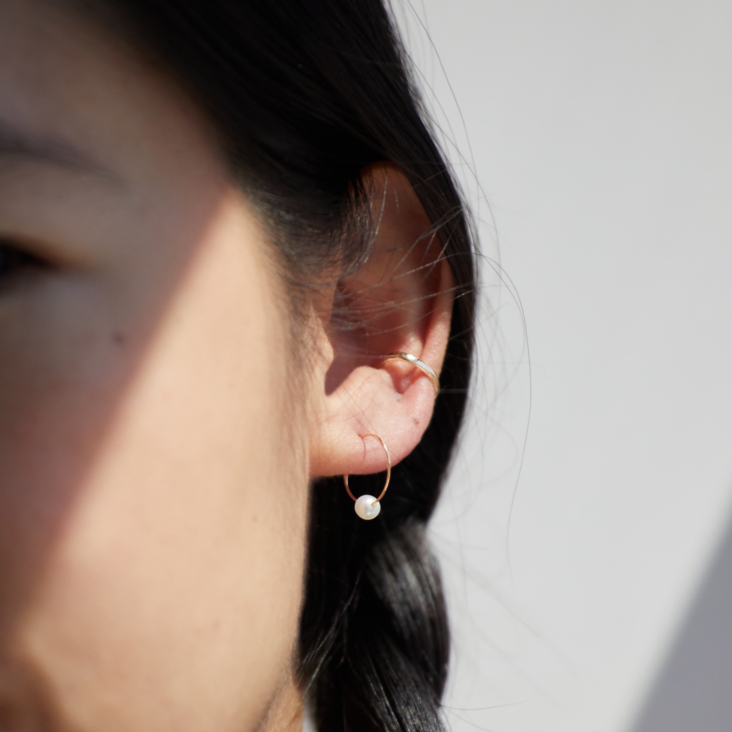 Alternative view of Pearl on a Wire Gold Hoop Earrings (single)